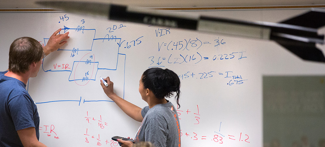 Physics students studying