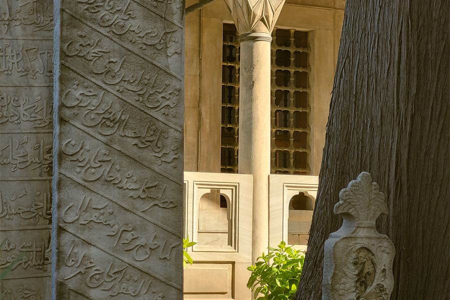 A pillar with Arabic writing.