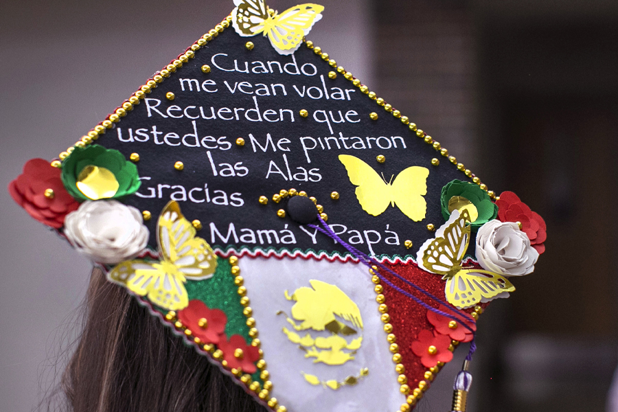 A student at graduation decorated their cap with the Mexican flag.