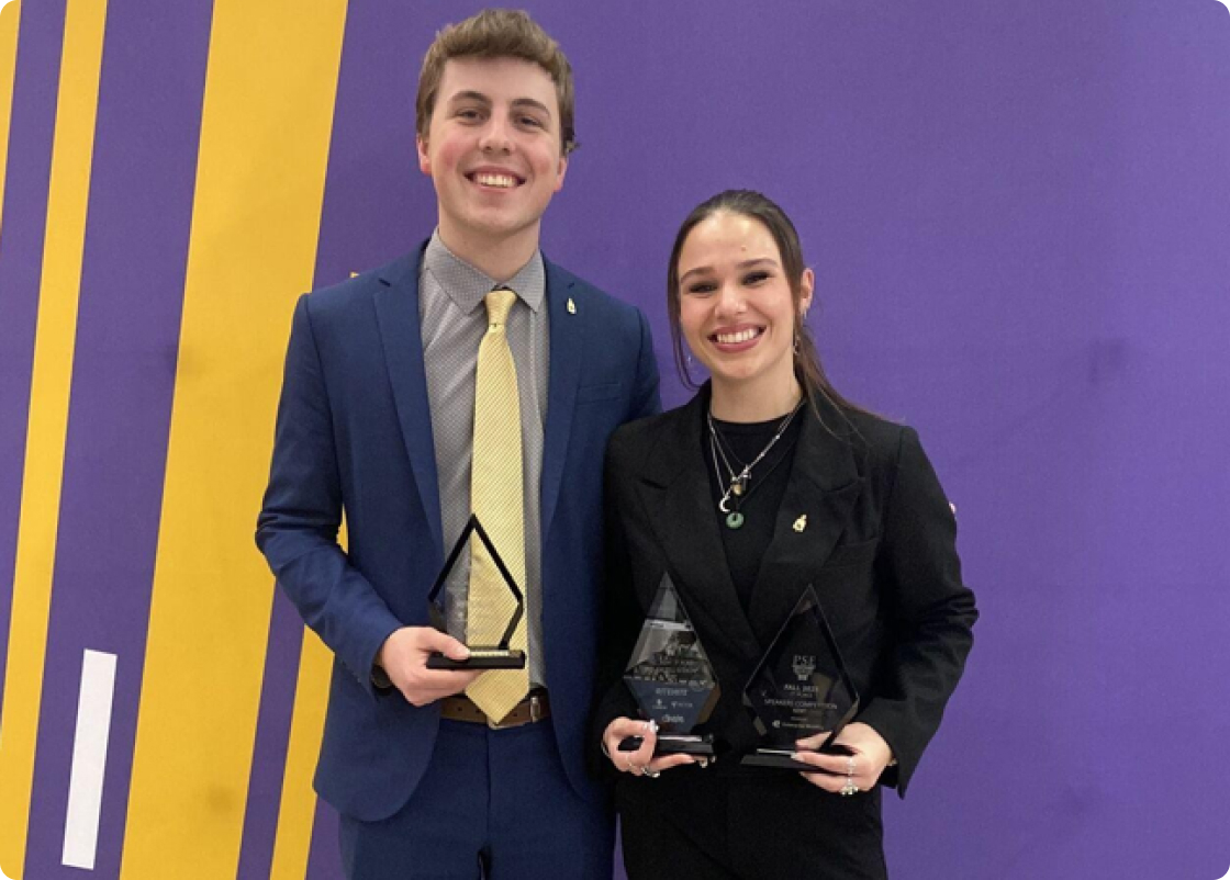 Noah Verhasselt (left) and Bailey Quinn (right) display their trophies after earning top individual placements at the Fall Conference.