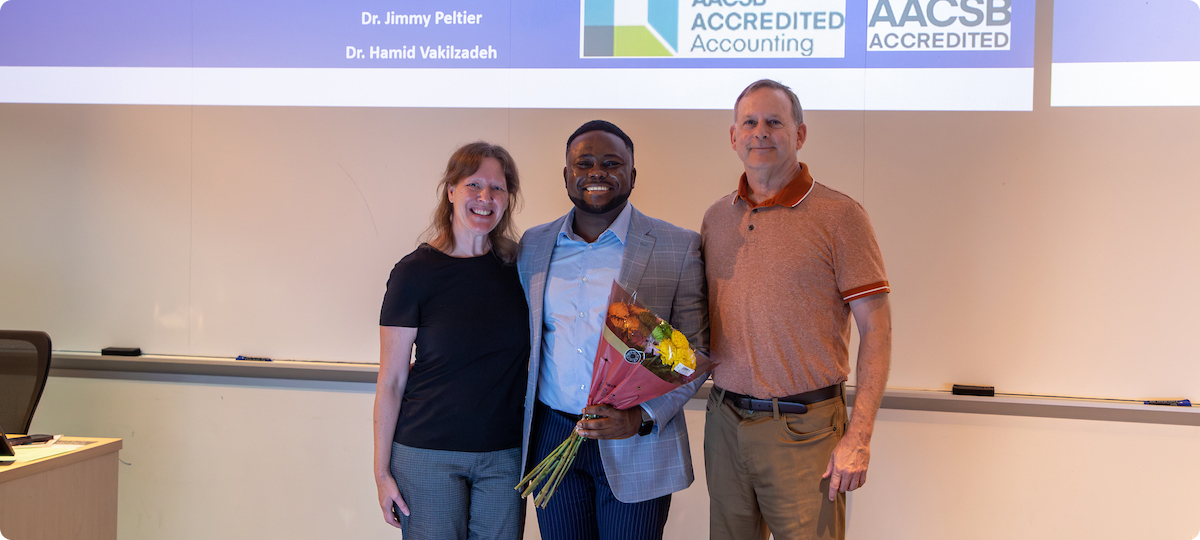 : From left, Jodi Gissel, dissertation committee chair, Patrice Achu, and Jimmy Peltier, dissertation committee second chair.