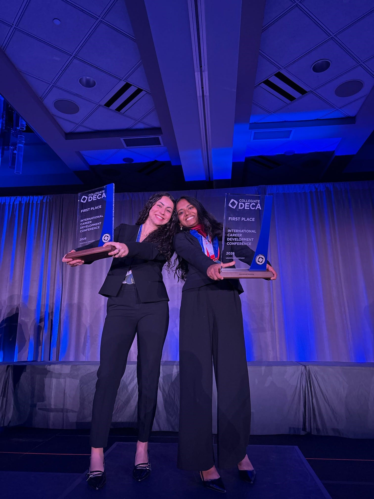 Shalomi Sahabandhu and Carla Martinez-Falero Gestoso pose with their 1st Place International Marketing trophy at the 2026 International Career Development Conference in Louisville, KY.