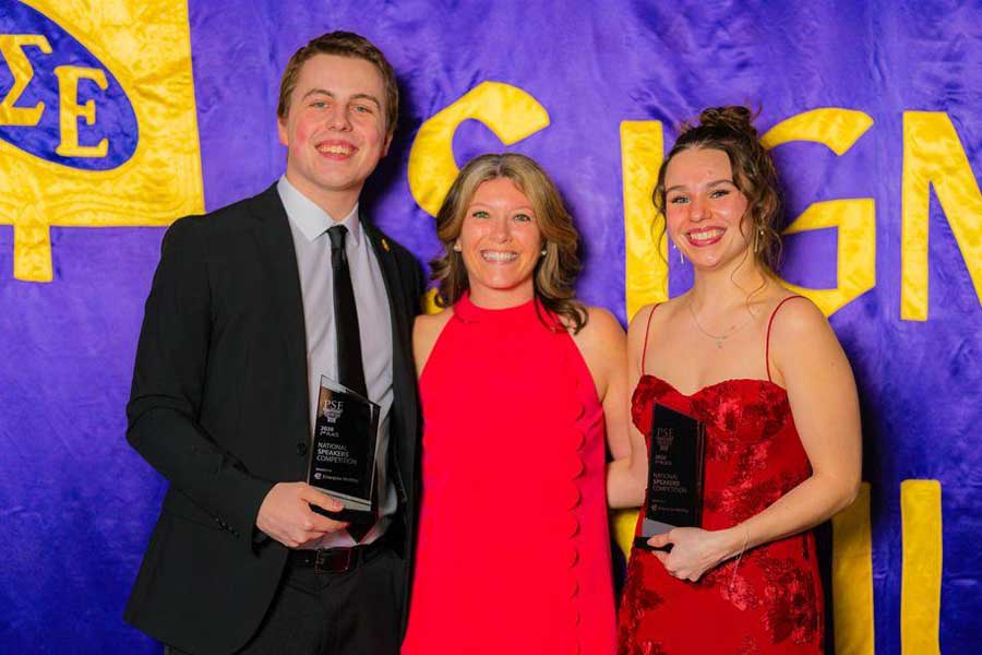 Bailey Quinn (right) and Noah Verhasselt (left) holding first and second place awards respectively.