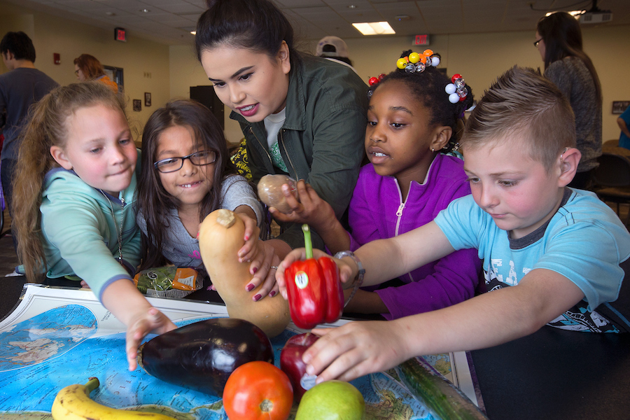 Student teaching young kids about sustainability at UW-Whitewater.