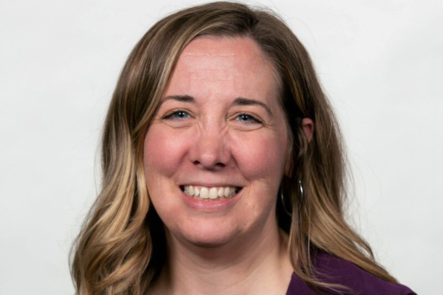 Headshot of Amanda Krier-Jenkins wearing a purple shirt.