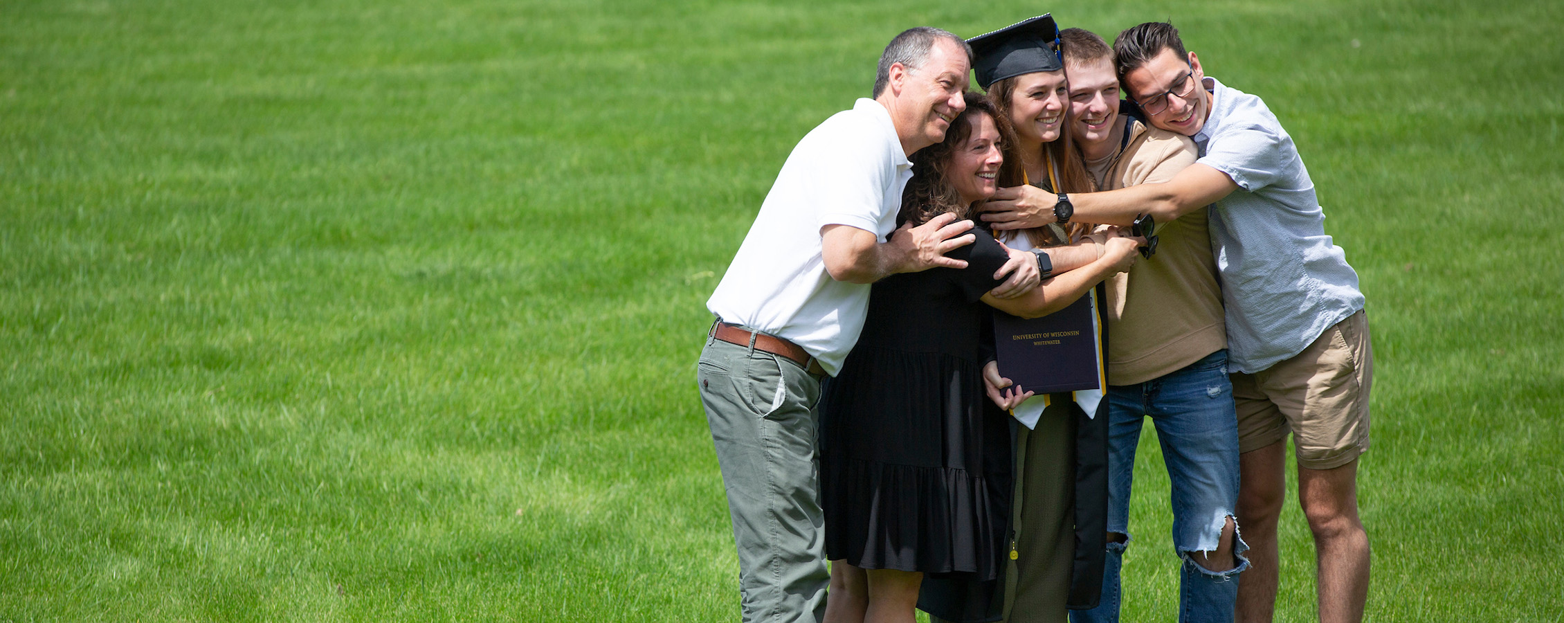 UW-Whitewater students celebrates graduation with her family