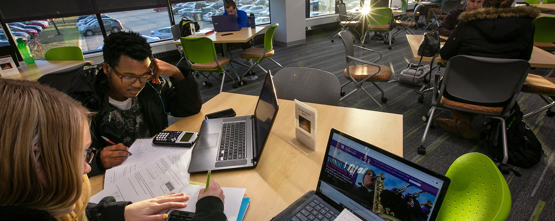 Students sitting at a table studying in the Student Success Center