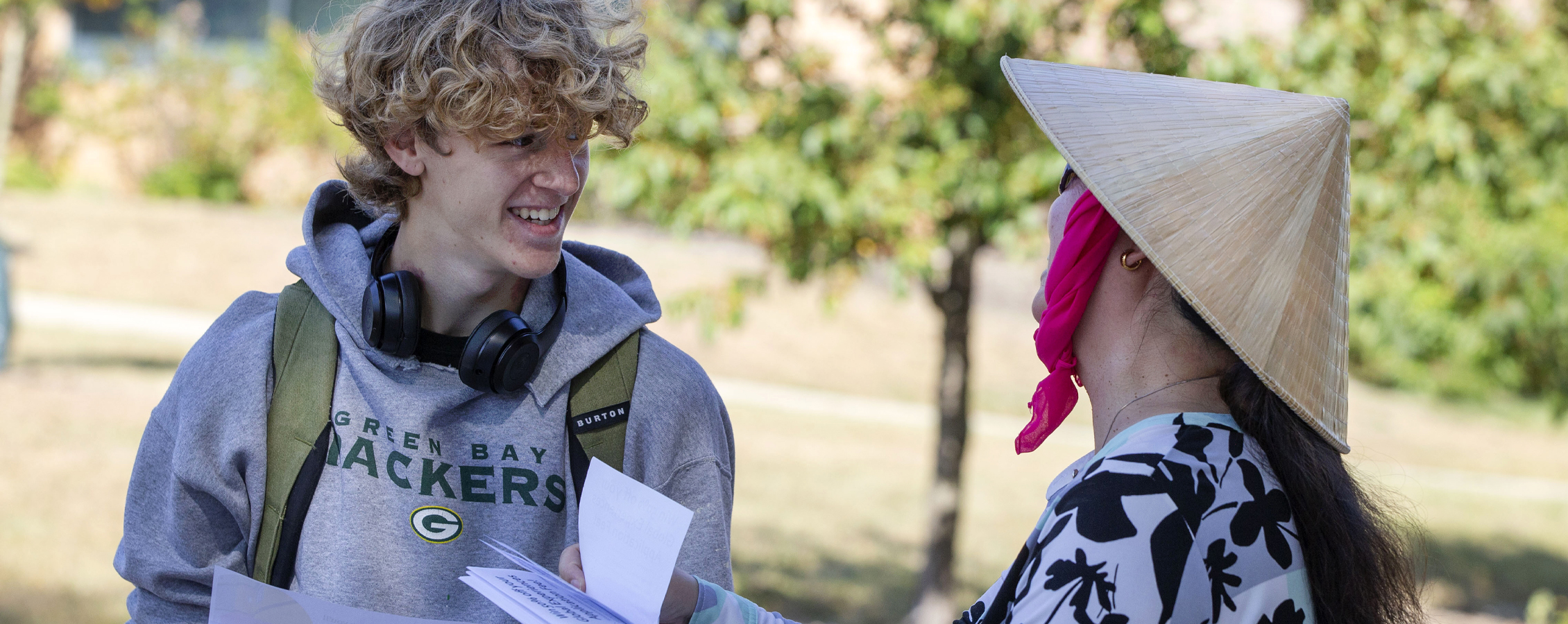 Two people look at a flyer.