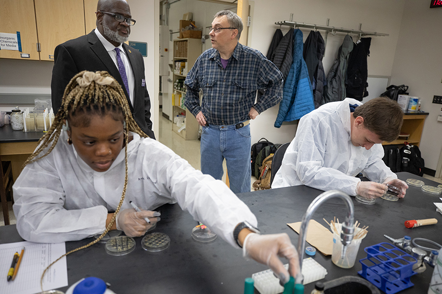 Two students work in a science lab.