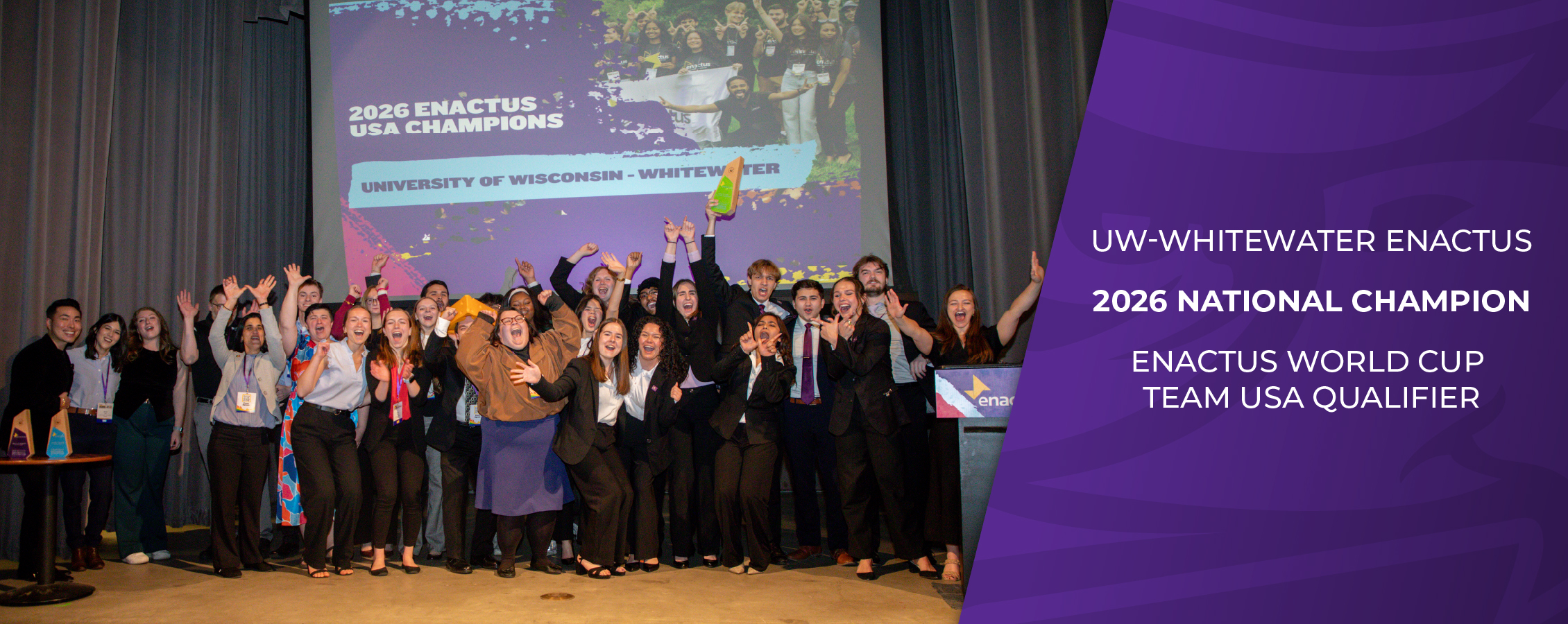 A group of people cheer with their arms raised and copy that says UW-Whitewater Enactus 2026 National Champions.