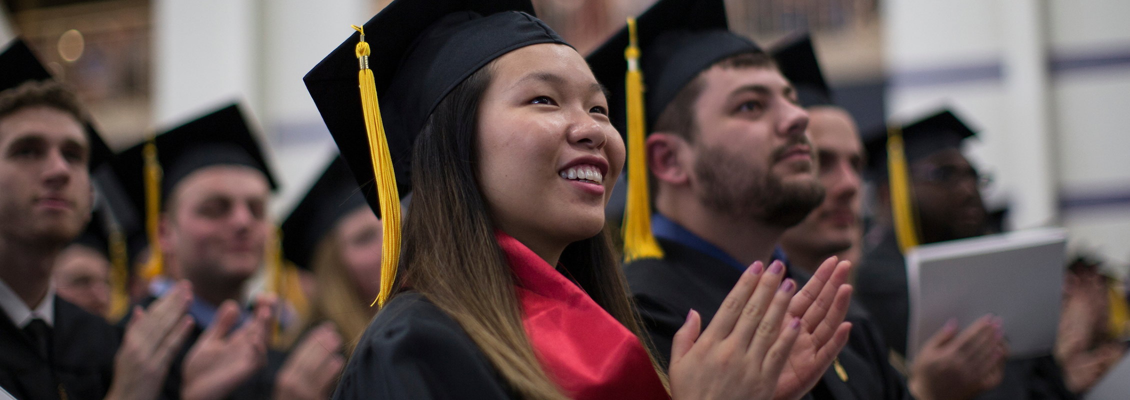 International student applanuding at UW-Whitewater graduation