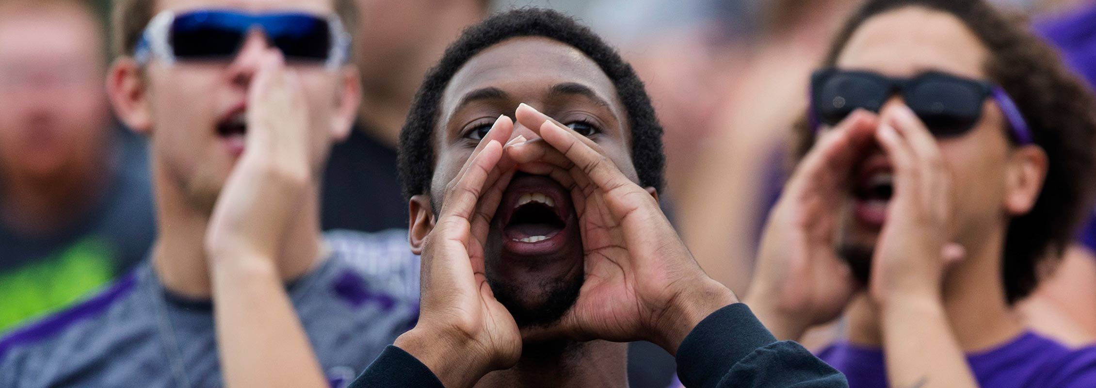 International student cheering at a UW-Whitewater event