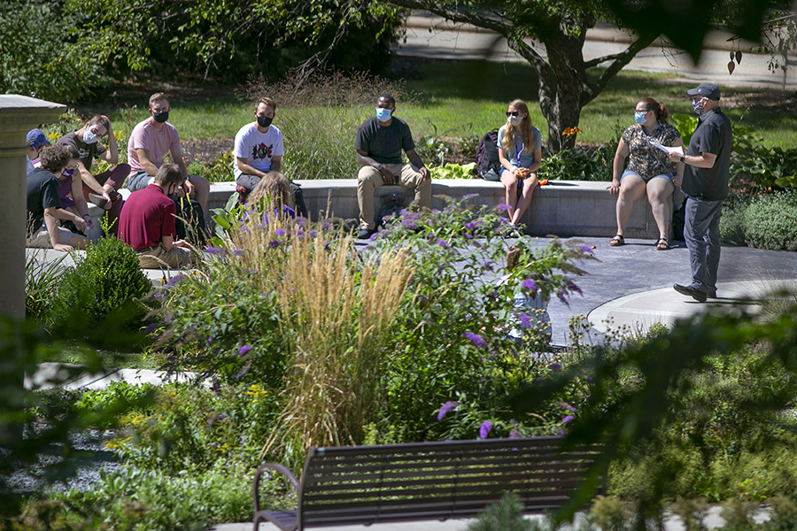 Students sit in the Memory Garden.