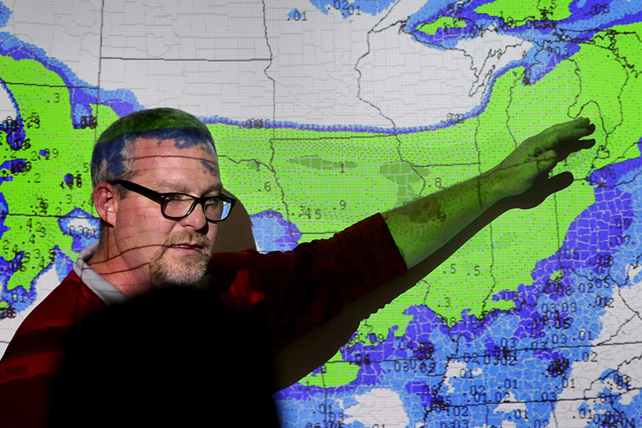 John Frye stands in front of a forecast map.