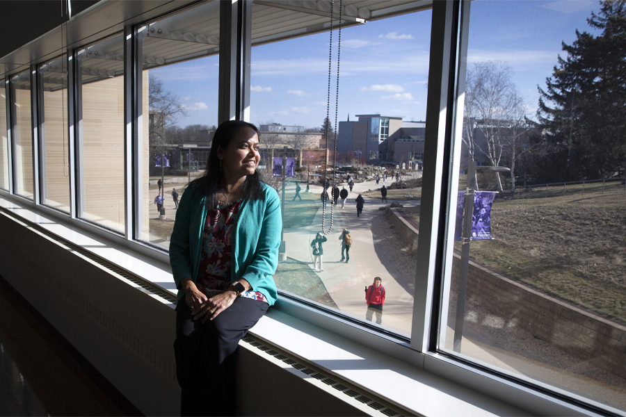 Rashiqa Kamal looks out onto campus from one of her classrooms in Hyland Hall..