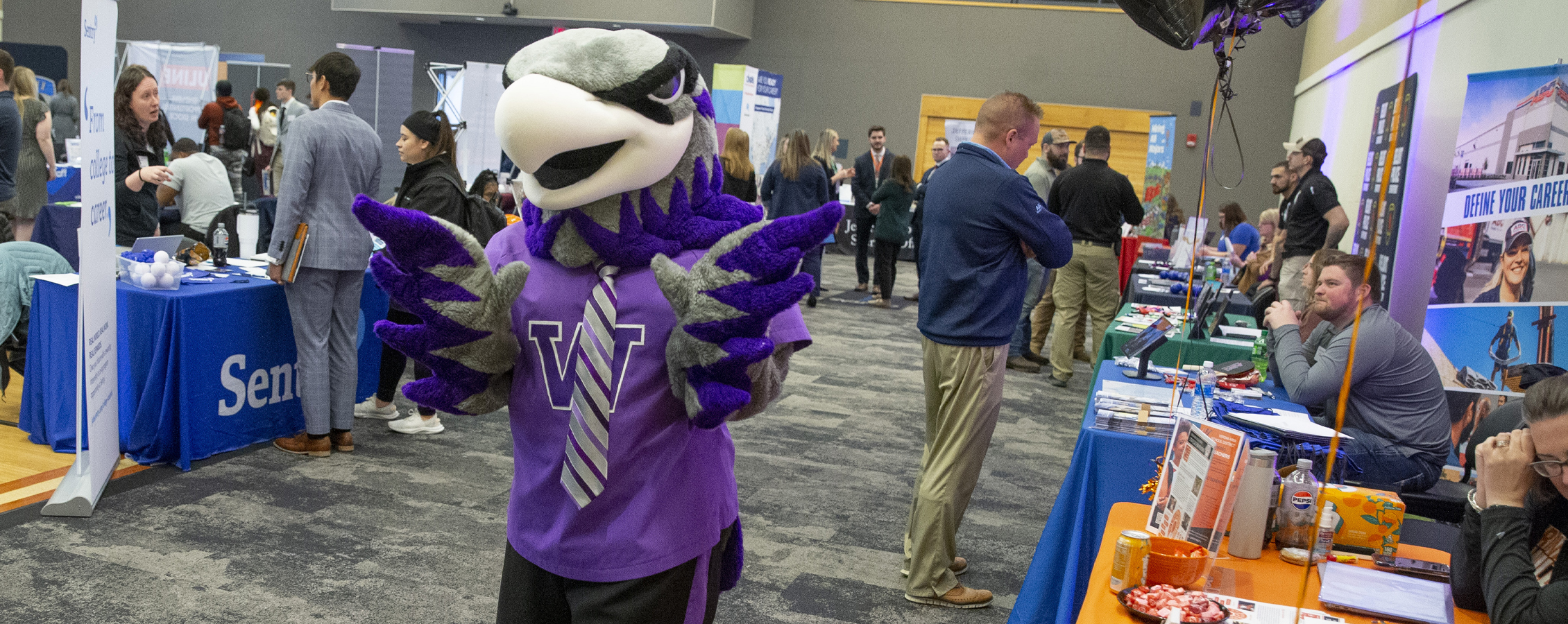 Jeffrey Pohorski runs through a crowd of students with a Go Pro.