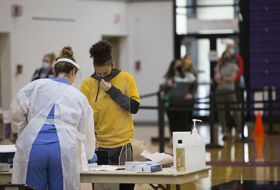 Student at table registering for surge testing