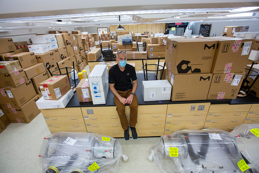 John Ejnik sits on a truckload of donations from MilliporeSigma