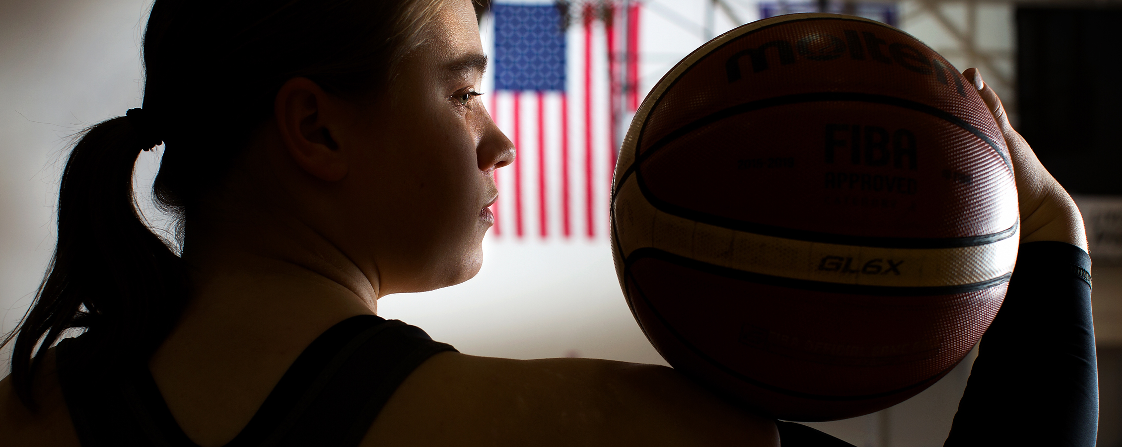 Warhawk Lindsey Zurbrugg holds a basketball.