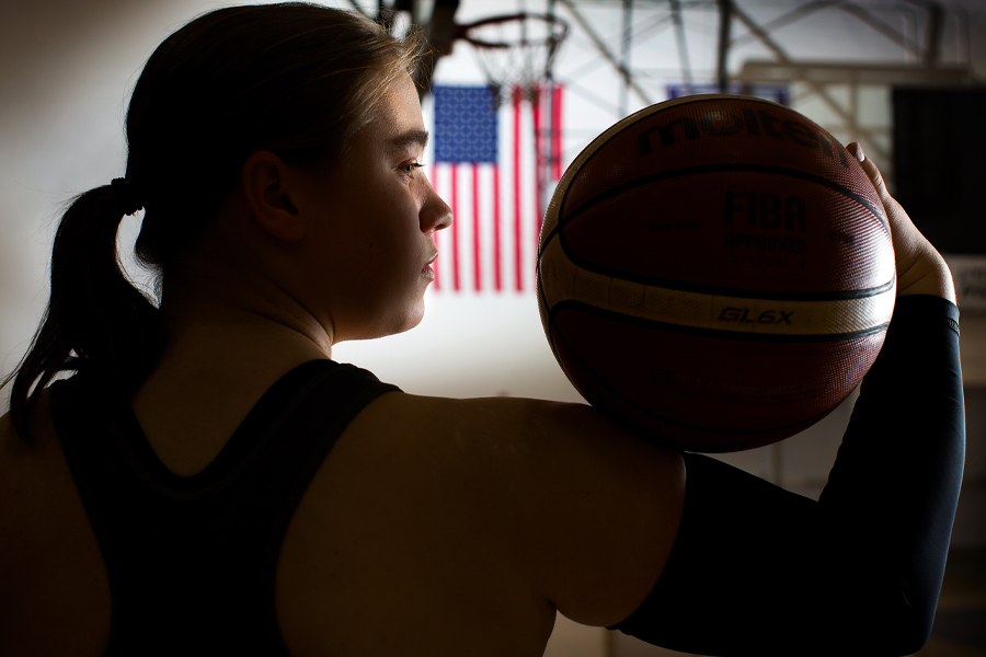 Lindsey Zurbrugg holds a basketball.