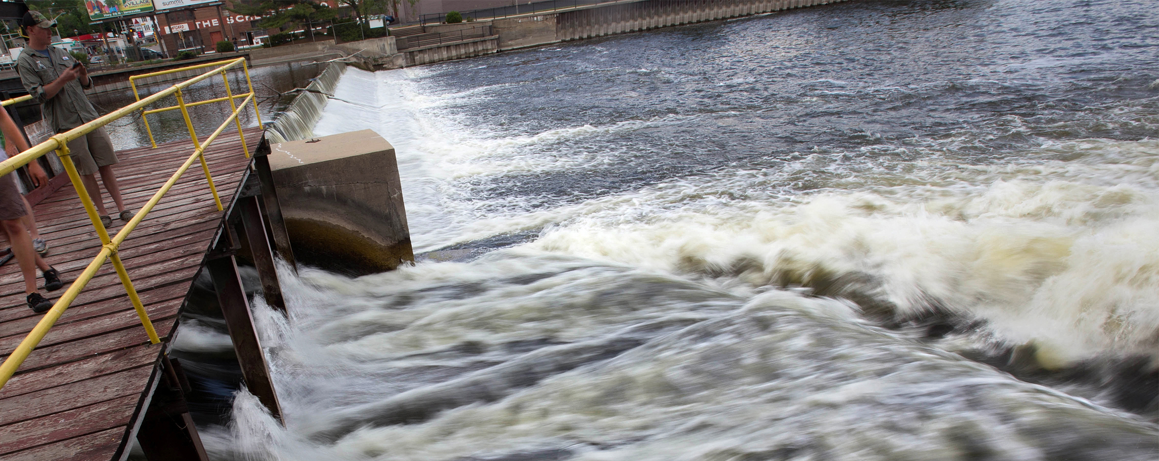 Water rushes through a dam.