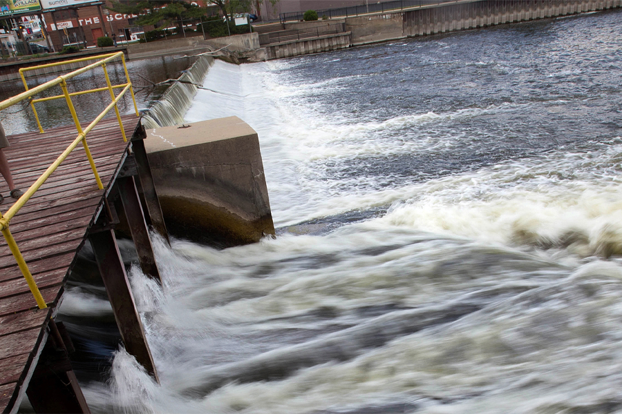 Water rushes through a dam.