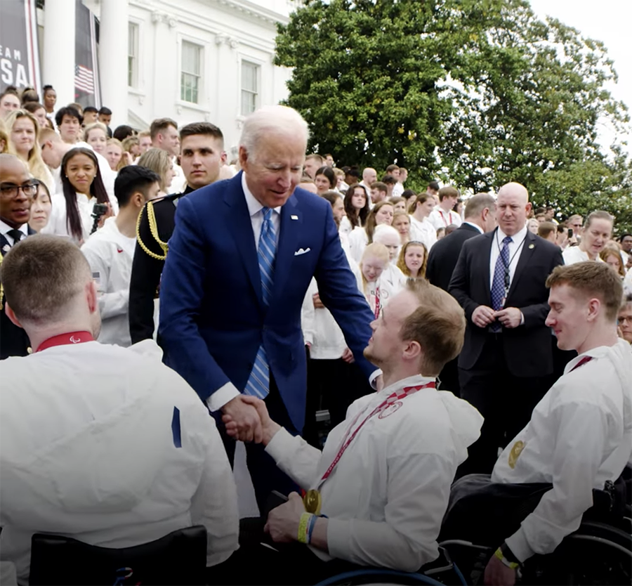 John Boie shakes hands with President Biden in front of the White House.