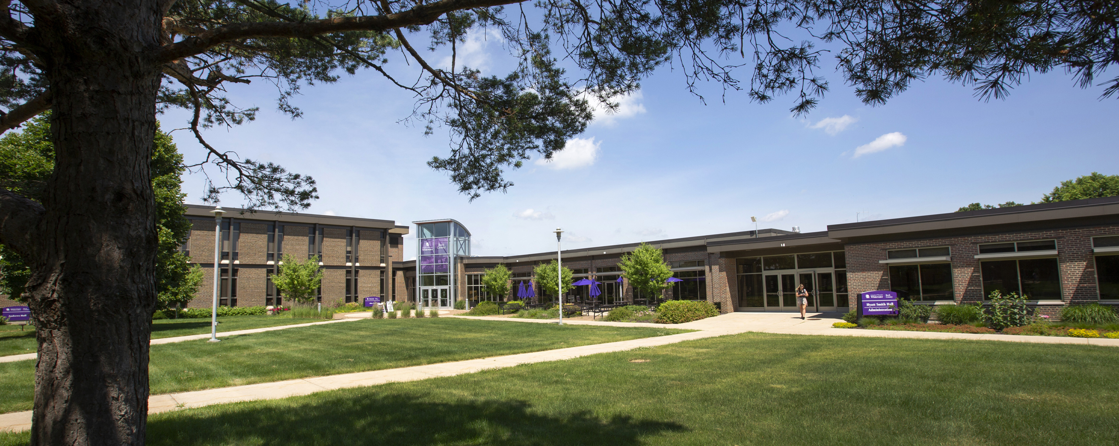 Exterior photo of the Rock County campus during summer.