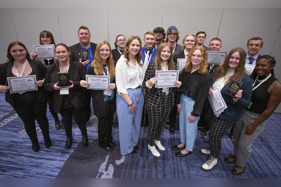 Group of people with certificates.