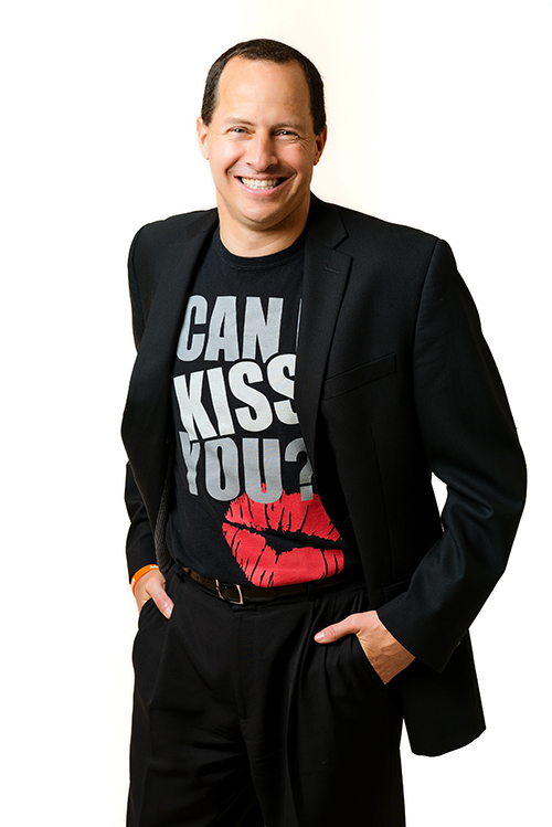 Domitrz wearing a shirt that says Can I Kiss You.