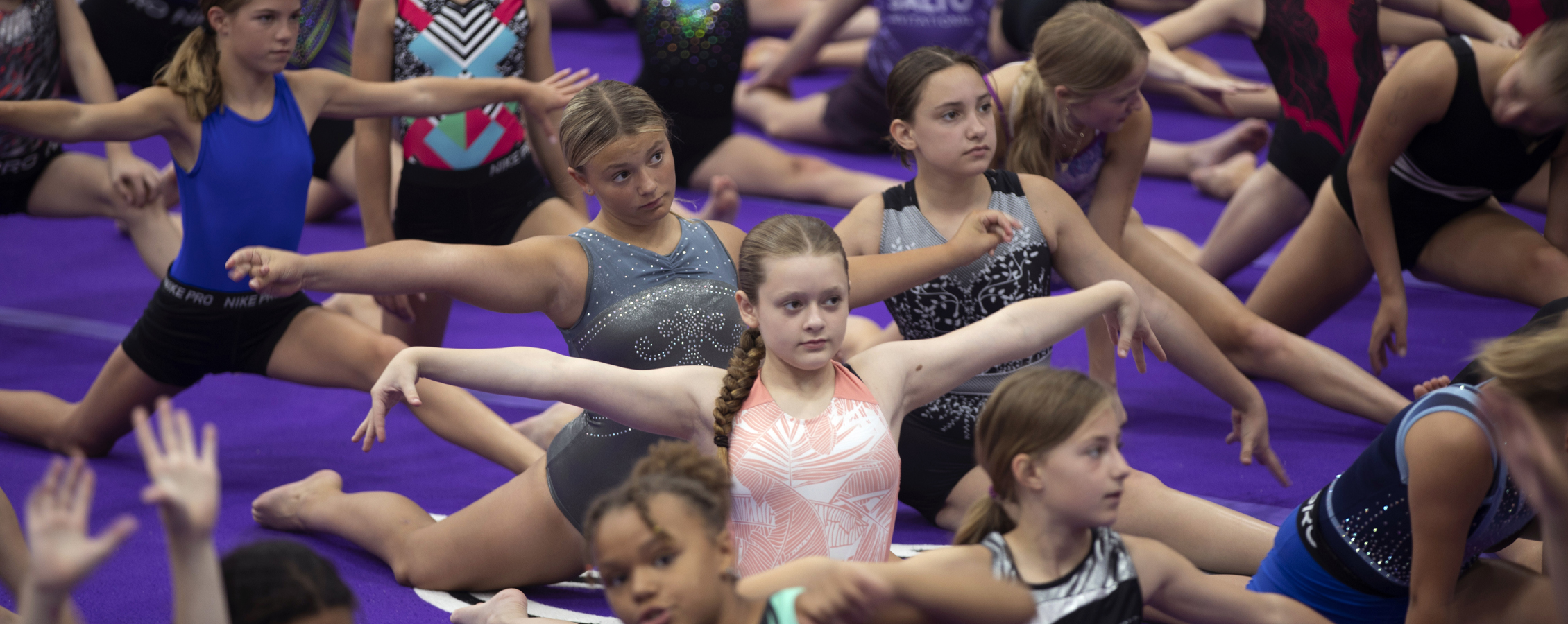 Young girls at a gymnastics camp.