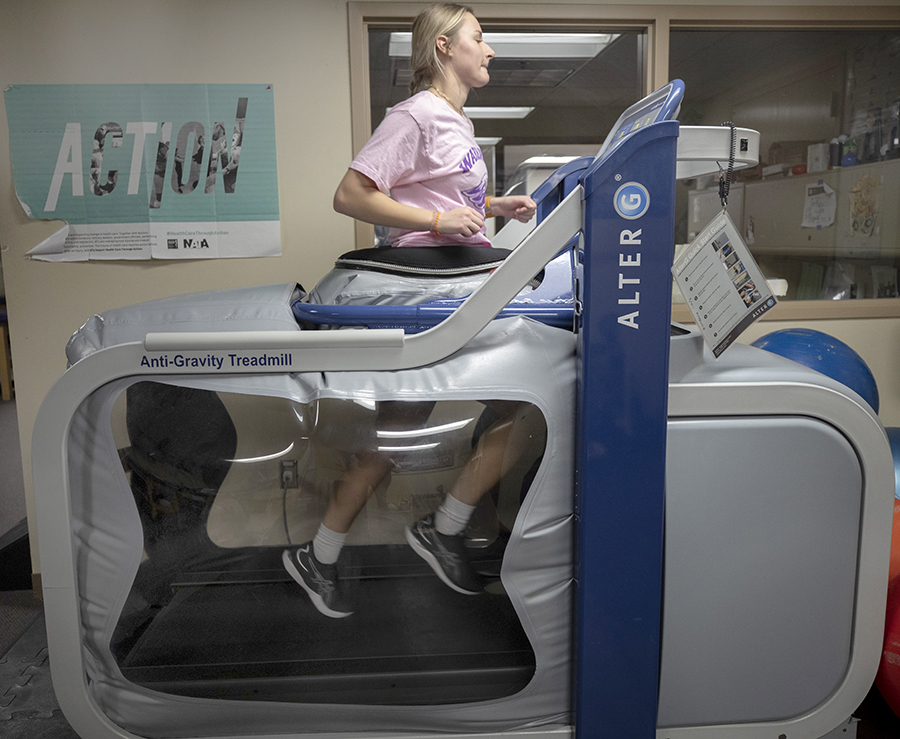 A person runs on a treadmill.