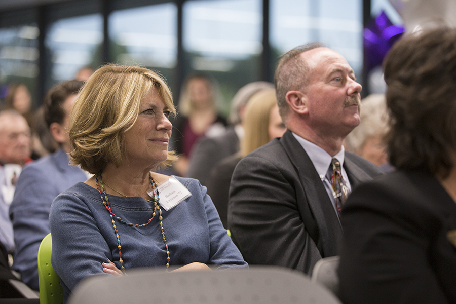 Kreisman sits, smiling.