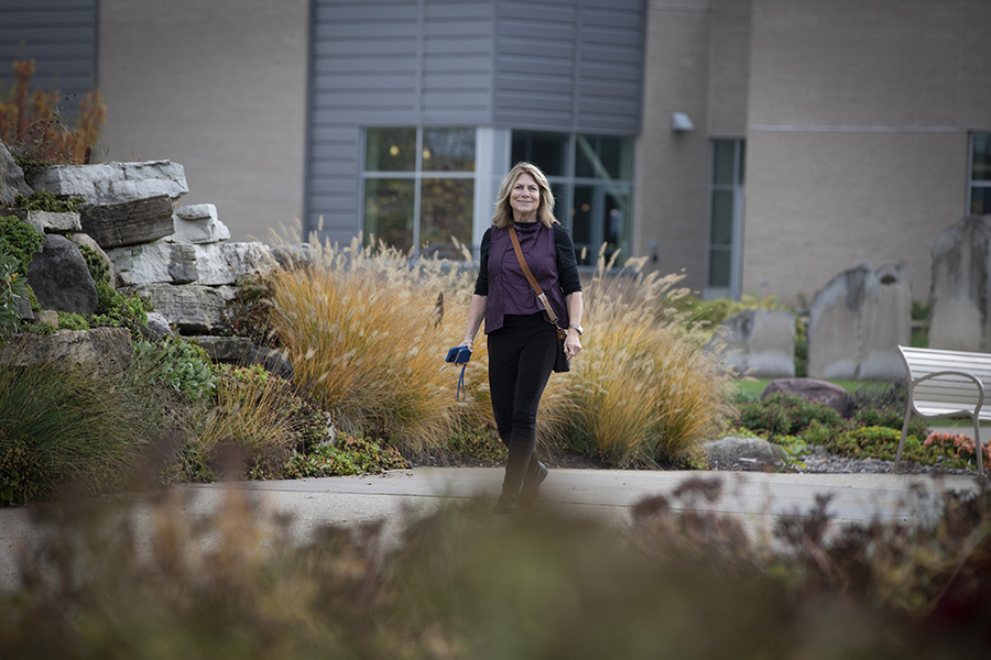 Barbara Kreisman walks outdoors.