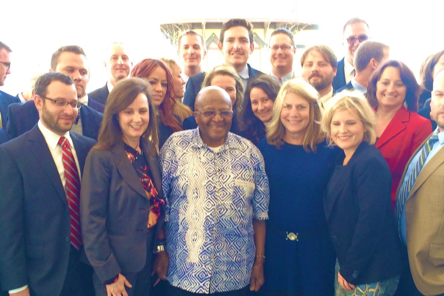 Kreisman stands in a group with Desmond Tutu.