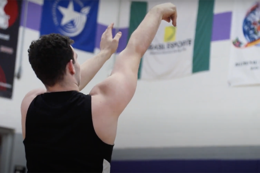 A wheelchair basketball player takes a shot.