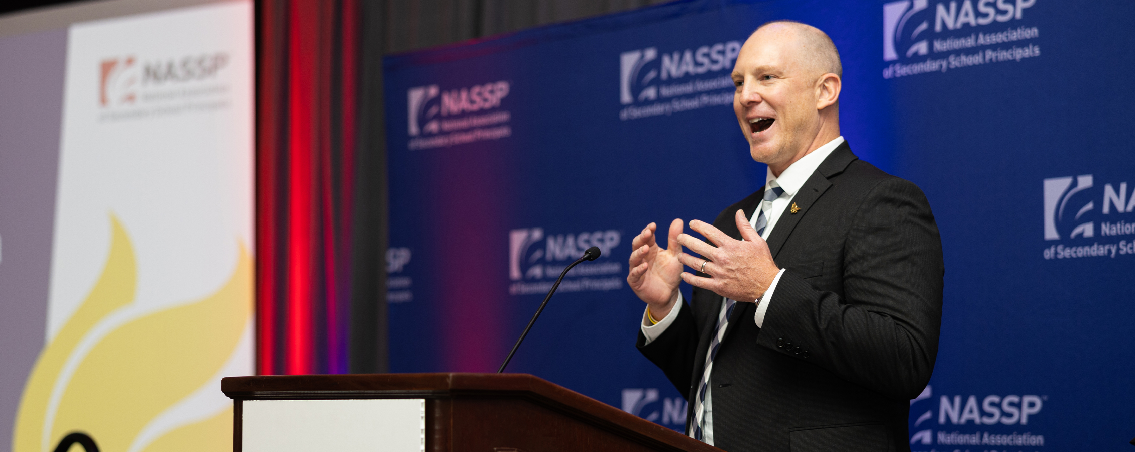 Andy Farley speaks at a podium.