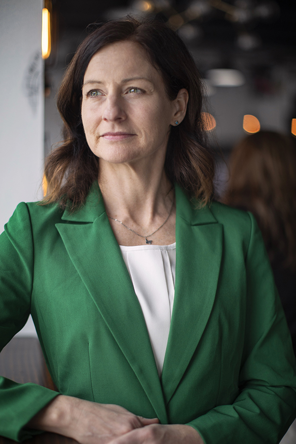 Angela Rachidi in a green blazer.