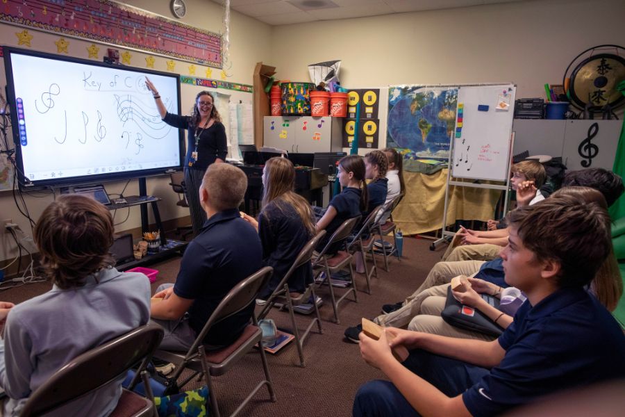 Lisa Warner teaches to students in a classroom.