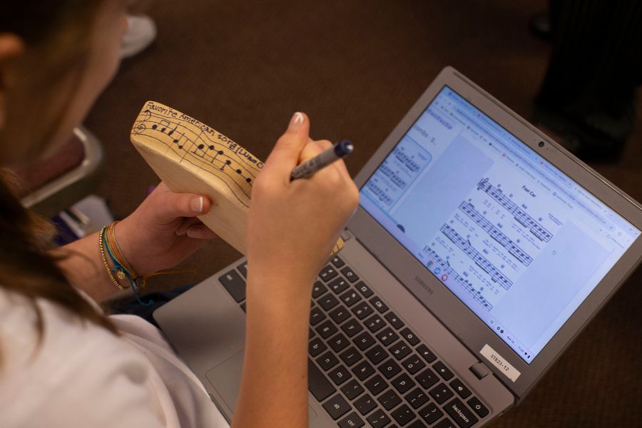 Student is typing on a computer.