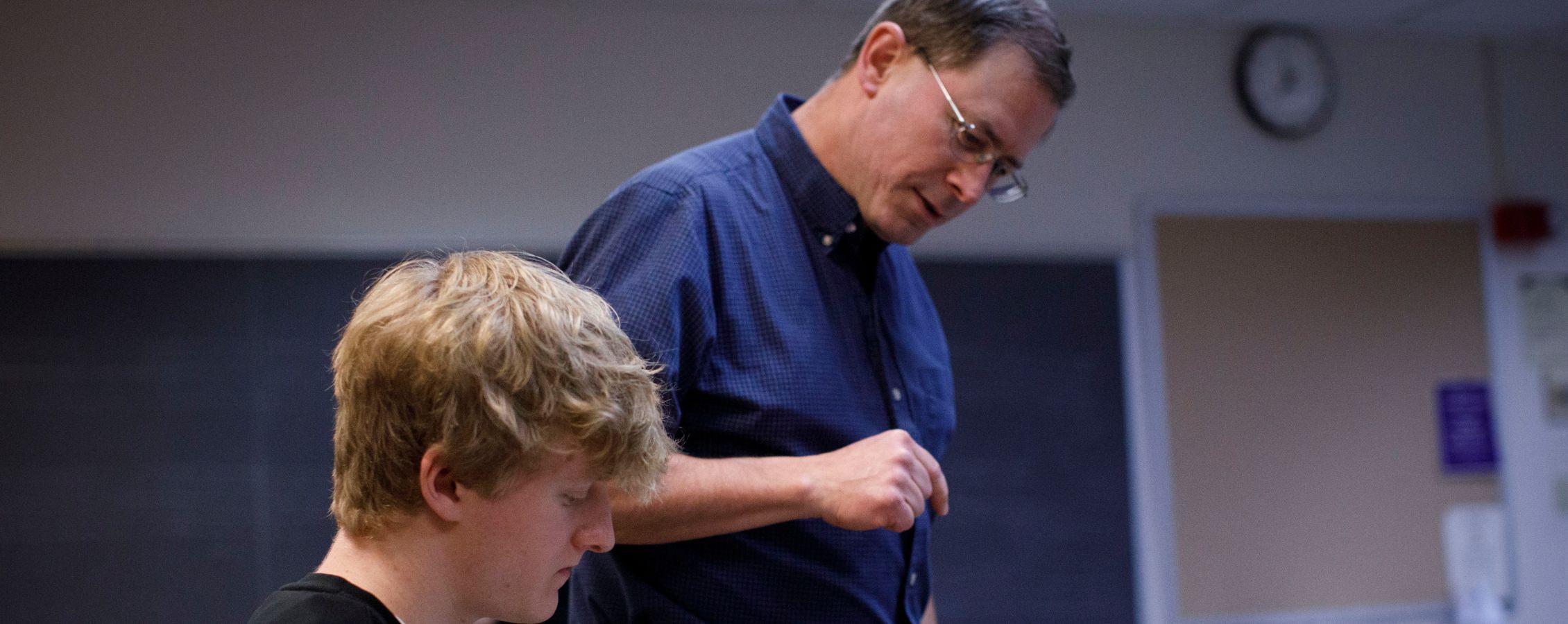Professor is in class with student.