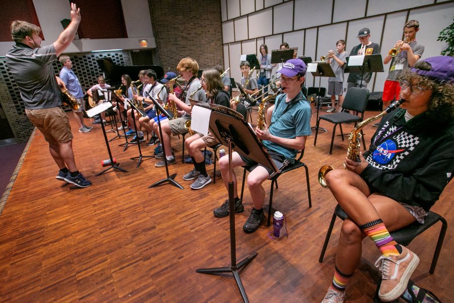 Campers are playing instruments.