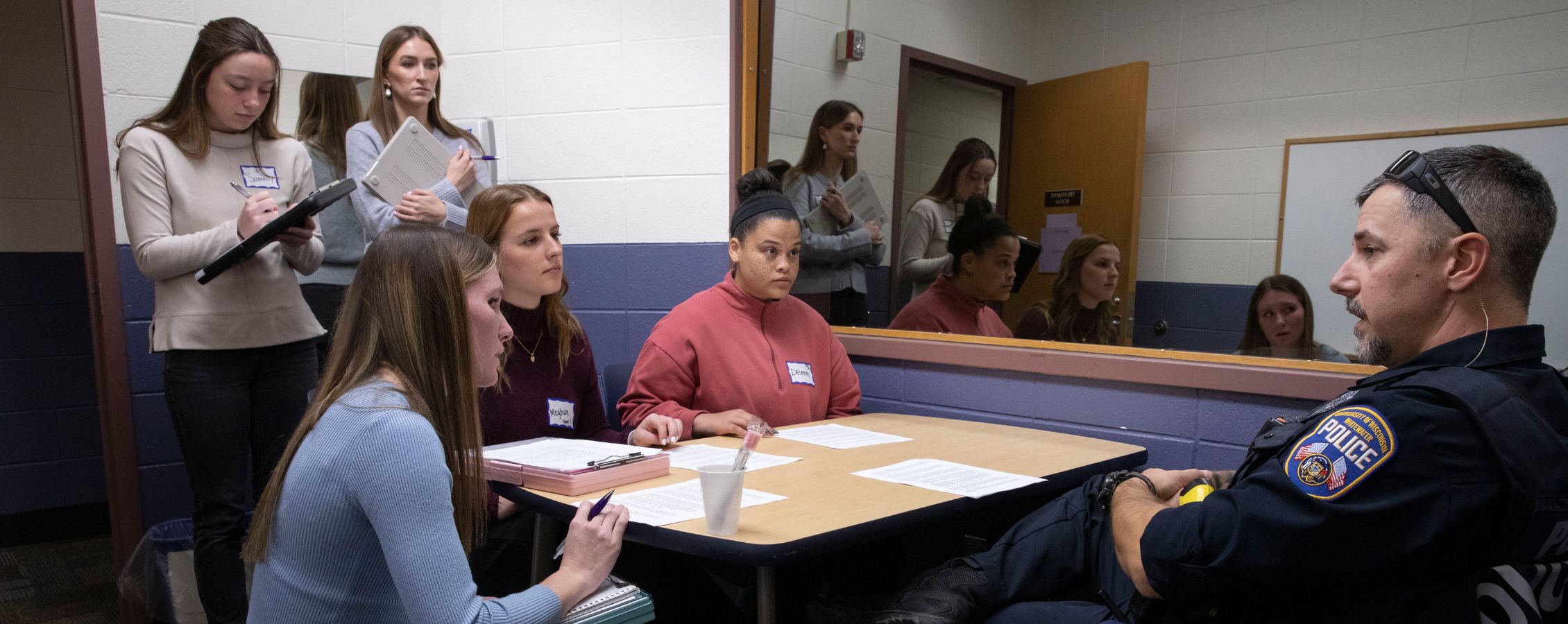 Officer Ryan Dewing, right, of the UW-Whitewater Police, participates in a case simulation with the Department of Communication Sciences and Disorders.