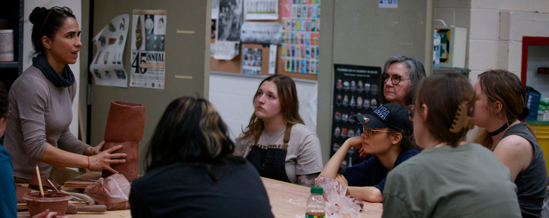 Cristina speaks to students in a classroom.