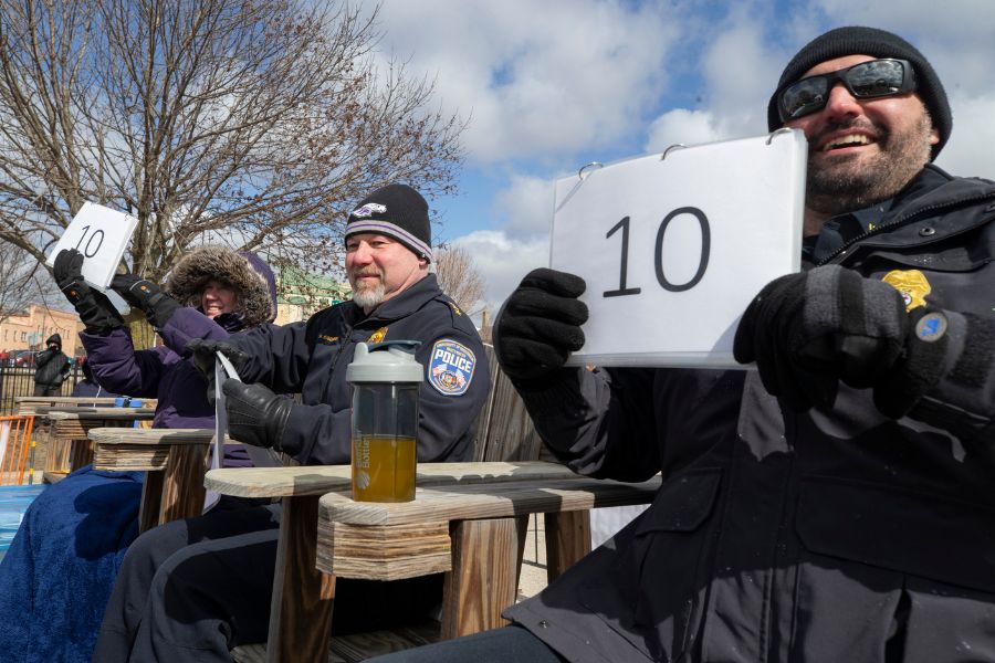 Matt Kiederlen, center, chief of the UW-Whitewater Police Department, and Dan Meyer, Chief of Police for the City of Whitewater, judge Polar Plunge participants.