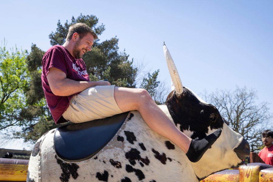 Cade rides a bull at UW-Rock County. 