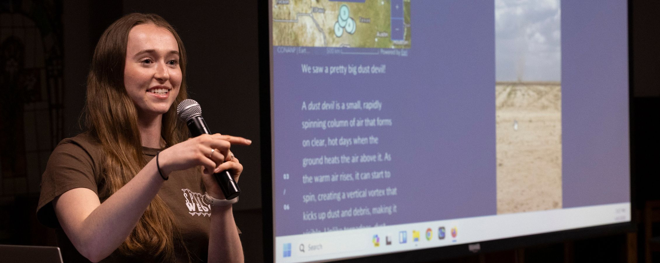 Photo of Sabrina speaking to an audience.