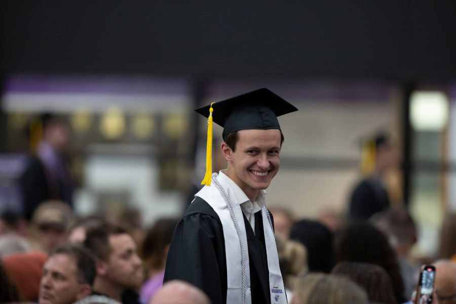 Chris walks through the audience during commencement.