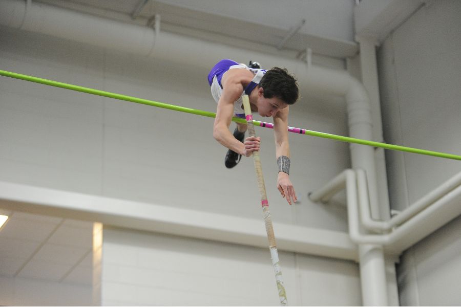 Student is performing athletics at an event at the fieldhouse