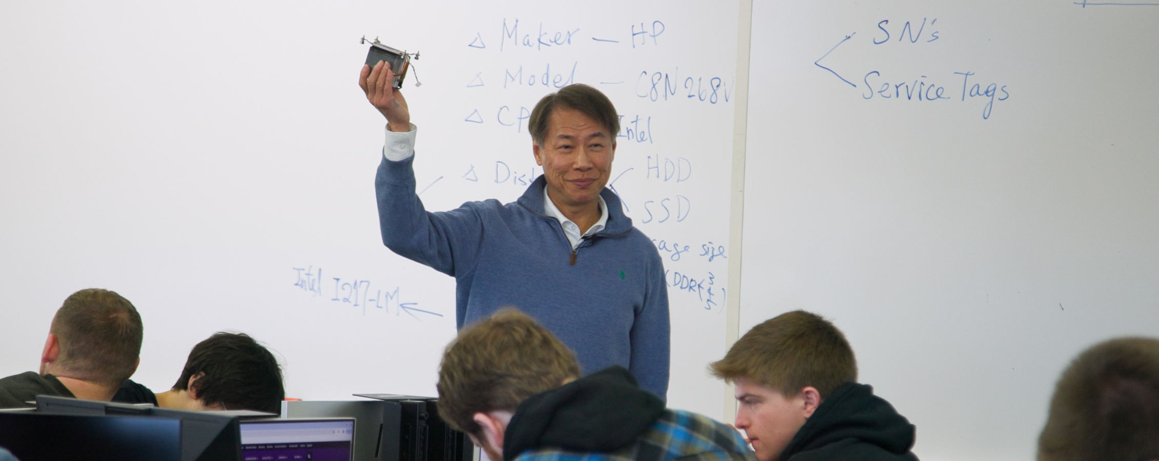 Royer Yin speaks to a classroom.